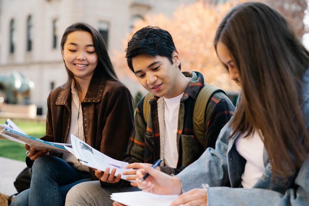 pexels-photo-7972967-7972967-1 Group of college students studying together on campus in autumn.
